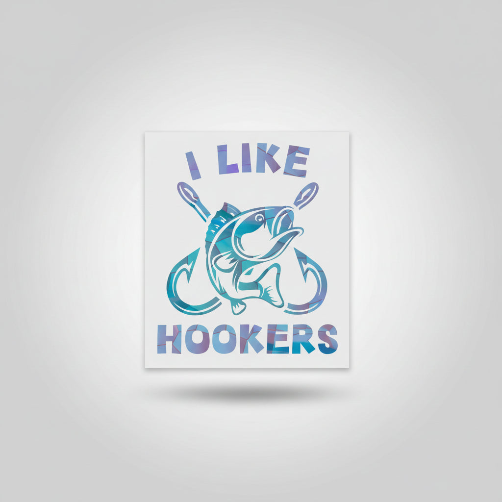 Hand holding a sticker with 'I Like Hookers' design on a kitchen floor.